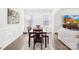 Comfortable dining area with wood table set, windows for natural light, and view of living room at 191 Tackle Box Dr, Troutman, NC 28166
