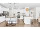Modern kitchen with stainless steel appliances, two large center islands, and bright white cabinetry at 191 Tackle Box Dr, Troutman, NC 28166