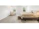 Bright primary bedroom featuring a king bed, sitting area, and lots of natural light at 191 Tackle Box Dr, Troutman, NC 28166