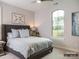 Comfortable bedroom with a cozy bed, soothing decor, and a large window offering serene views at 19329 Youngblood W Rd # 4, Charlotte, NC 28278