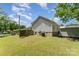 A spacious backyard with a well-maintained lawn, wooden fence, and storage shed for outdoor activities at 201 Easy St, Concord, NC 28027