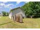 Backyard featuring a partially fenced yard and view of the house at 201 Easy St, Concord, NC 28027