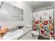 Bathroom with a floral shower curtain, a toilet, vanity, mirror, and sink at 201 Easy St, Concord, NC 28027