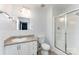 Clean bathroom with a shower, toilet, vanity, and a well-lit mirror at 201 Easy St, Concord, NC 28027