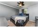 Bedroom with neutral walls, carpeted floor, ceiling fan, and a comfortable queen bed at 201 Easy St, Concord, NC 28027