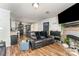 Inviting living room featuring hard wood floors, neutral-toned walls, a fireplace and an open concept layout at 201 Easy St, Concord, NC 28027