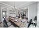 Bright dining room featuring a large wooden table and dark chairs, with views of the living spaces at 2025 Masons Bend Dr, Fort Mill, SC 29708