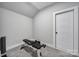 Bright, gray exercise room with carpet, a fitness bench, and a set of weights, offering a private workout space at 2025 Masons Bend Dr, Fort Mill, SC 29708