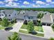 Aerial view of a charming home with well-maintained landscaping, a two-car garage, and a welcoming front entrance at 2025 Masons Bend Dr, Fort Mill, SC 29708