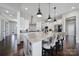 Bright kitchen features a spacious island, modern appliances, and stylish pendant lighting at 2025 Masons Bend Dr, Fort Mill, SC 29708