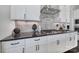 Modern kitchen with custom cabinetry, stainless steel appliances, and designer backsplash at 2025 Masons Bend Dr, Fort Mill, SC 29708