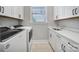 Functional laundry room with sink, cabinets, and modern washer and dryer at 2025 Masons Bend Dr, Fort Mill, SC 29708