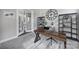 Office featuring a dark wooden desk, a light-colored carpet, and a large clock on the wall at 2025 Masons Bend Dr, Fort Mill, SC 29708