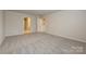 Spacious bedroom featuring neutral walls, carpet flooring, and ample space at 2149 Sunflower Cir, Newton, NC 28658