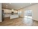 Bright kitchen with stainless steel appliances, white cabinets, and a large island perfect for food prep and entertaining at 2149 Sunflower Cir, Newton, NC 28658