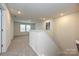 Upstairs loft area with neutral carpet, natural light from a window, and access to multiple rooms at 2149 Sunflower Cir, Newton, NC 28658