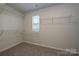 Organized walk-in closet with shelving and a window for natural light at 2149 Sunflower Cir, Newton, NC 28658