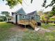 Back exterior showcasing a new wood deck, siding, and backyard at 222 Brevard St, Statesville, NC 28677