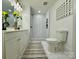 Stylishly renovated bathroom with shower and decorative floor mat at 222 Brevard St, Statesville, NC 28677