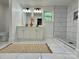 Modern bathroom with double vanity, walk-in shower, and sleek white tiles at 222 Brevard St, Statesville, NC 28677
