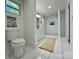 Bright bathroom with modern toilet, sleek shower, and a decoratively placed rug at 222 Brevard St, Statesville, NC 28677