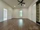 Spacious bedroom featuring hardwood floors, ceiling fan, and closet at 222 Brevard St, Statesville, NC 28677