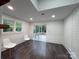 Bright dining space features hardwood floors, neutral paint, natural light, and access to a back deck at 222 Brevard St, Statesville, NC 28677