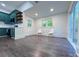 Bright dining space features hardwood floors, neutral paint, natural light, and access to a back deck at 222 Brevard St, Statesville, NC 28677