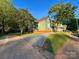 Home exterior with a driveway and well-maintained lawn and landscaping at 222 Brevard St, Statesville, NC 28677