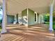 Spacious front porch with painted columns and wood flooring at 222 Brevard St, Statesville, NC 28677