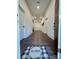 Bright hallway with wood floors, white doors, recessed lighting and 'Home' welcome mat, providing a warm welcome at 222 Brevard St, Statesville, NC 28677