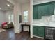 Charming kitchen with green cabinets, white countertops, and a stainless steel dishwasher at 222 Brevard St, Statesville, NC 28677