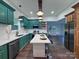 Stylish kitchen featuring green cabinets, quartz countertops, stainless steel appliances, and an island with bar stools at 222 Brevard St, Statesville, NC 28677