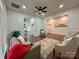 Spacious living area with wood floors, comfortable seating, and views into the open kitchen creating a cozy atmosphere at 222 Brevard St, Statesville, NC 28677