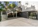 View of the back of the house, staircase, and gravel accents with concrete patio at 2224 Highland St, Charlotte, NC 28208