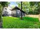 Professionally landscaped backyard features a new construction outbuilding and privacy fence at 2224 Highland St, Charlotte, NC 28208