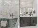 Luxurious bathroom featuring a sleek black soaking tub and dual vanities with modern fixtures and lighting at 2224 Highland St, Charlotte, NC 28208
