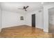 Bedroom featuring wood floors, a ceiling fan, and a neutral color scheme at 2224 Highland St, Charlotte, NC 28208