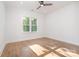 Bright bedroom with hardwood floors, plenty of natural light from the windows, and neutral decor at 2224 Highland St, Charlotte, NC 28208