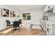 Cozy dining area with modern chairs, sleek table, and a sliding glass door to the outdoors at 2224 Highland St, Charlotte, NC 28208