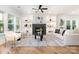 Bright living room boasts a fireplace, built-in shelving, and hardwood floors at 2224 Highland St, Charlotte, NC 28208