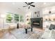 Elegant living room with fireplace, modern decor, and large windows at 2224 Highland St, Charlotte, NC 28208
