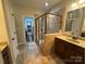 Beautifully tiled bathroom featuring a glass enclosed shower and granite countertops at 2279 Eversham Nw Dr, Concord, NC 28027