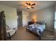Neutral bedroom with carpet, ceiling fan, furniture and natural light from the window at 2279 Eversham Nw Dr, Concord, NC 28027