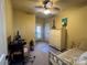 Bright bedroom with a cozy atmosphere and a convenient workspace at 2279 Eversham Nw Dr, Concord, NC 28027
