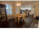 Cozy dining area featuring a charming chandelier and seamless flow into the kitchen at 2279 Eversham Nw Dr, Concord, NC 28027