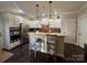 Bright kitchen with granite counters, stainless steel appliances, and a breakfast bar at 2279 Eversham Nw Dr, Concord, NC 28027
