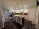 Modern kitchen featuring a center island, stainless steel appliances, and white cabinetry at 2279 Eversham Nw Dr, Concord, NC 28027