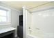 The bathroom features a stand-up shower with white tile and a black storage cabinet at 2306 W C St, Kannapolis, NC 28081