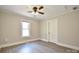 Bedroom featuring new hardwood floors, a window, ceiling fan, and a closet at 2306 W C St, Kannapolis, NC 28081
